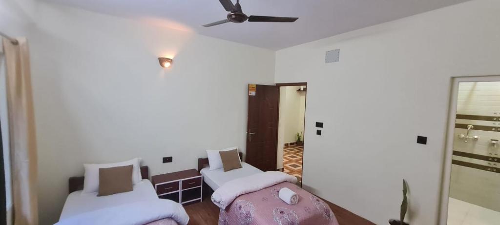 Postel nebo postele na pokoji v ubytování JAP Guest House & Apartments