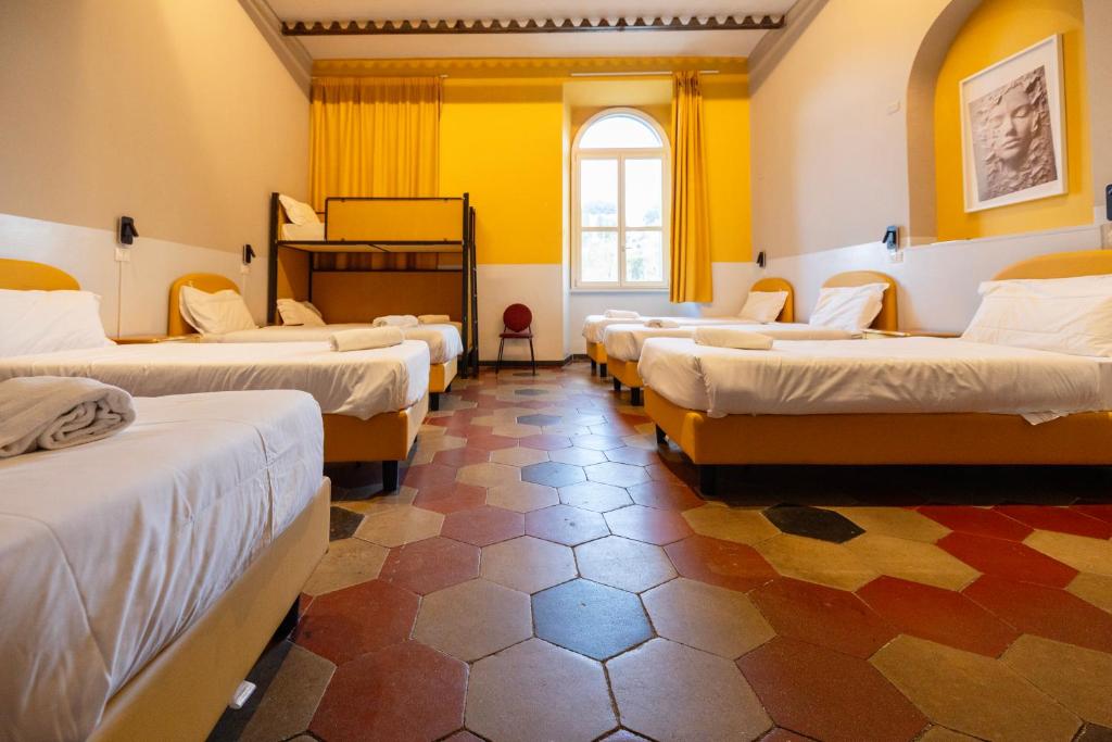Postel nebo postele na pokoji v ubytování Borgo Ripa Urban Travel