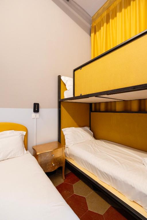 Postel nebo postele na pokoji v ubytování Borgo Ripa Urban Travel