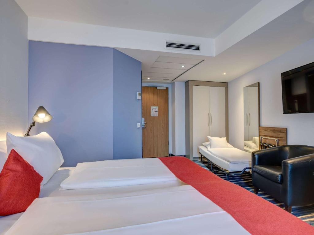 Postel nebo postele na pokoji v ubytování Mercure Hotel Hamburg Mitte