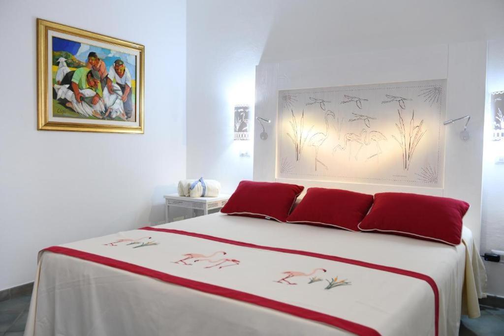 Postel nebo postele na pokoji v ubytování Alghero Sunrise