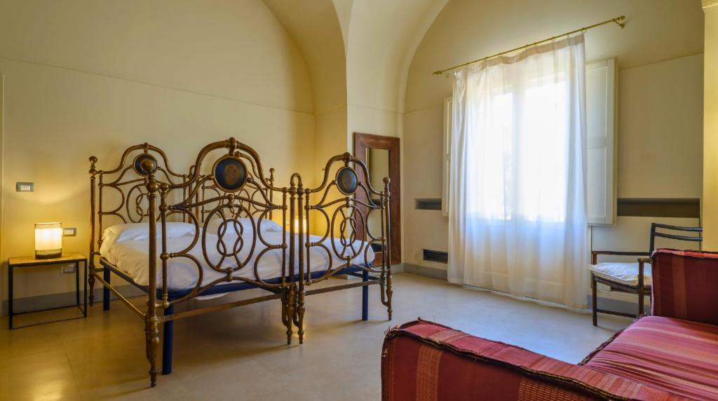 Łóżko lub łóżka w pokoju w obiekcie Masseria Bernardini by Symphonya Luxury Rentals
