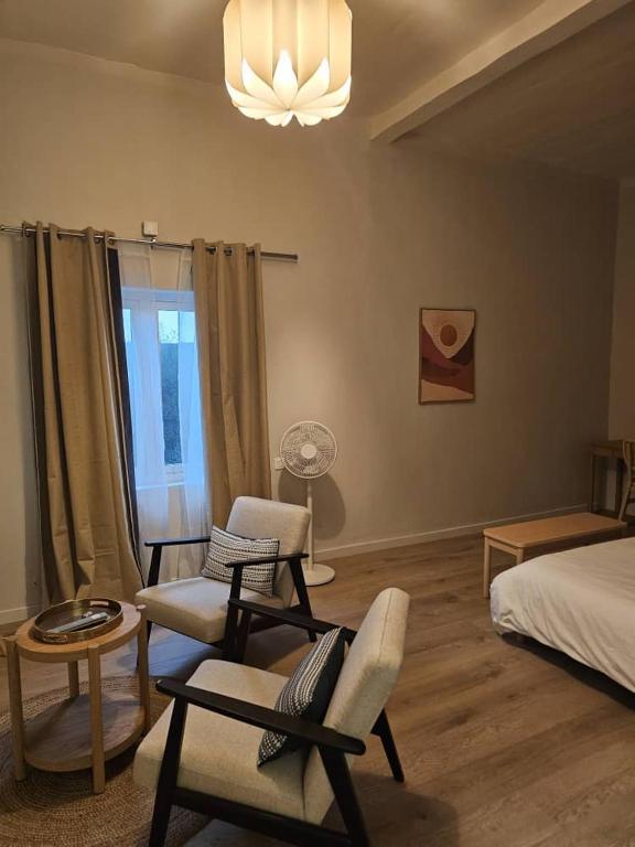 Postel nebo postele na pokoji v ubytování Tropical Oasis Hôtel