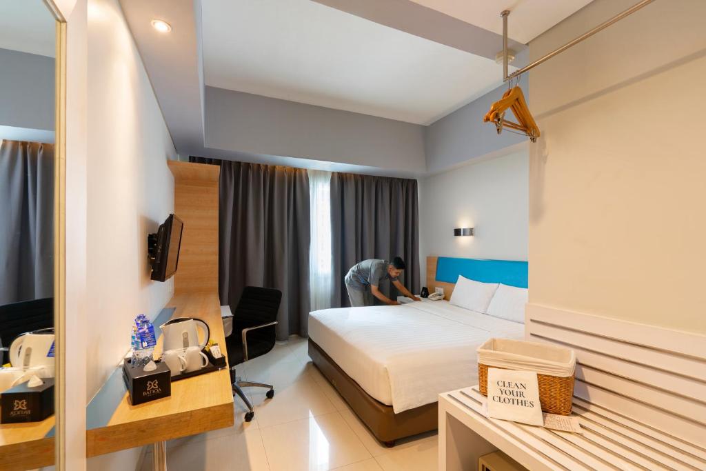 Voodi või voodid majutusasutuse BATIQA Hotel & Apartments Karawang toas