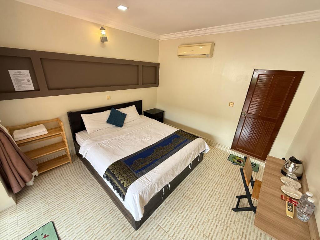 Postel nebo postele na pokoji v ubytování Hello Kampot Resort