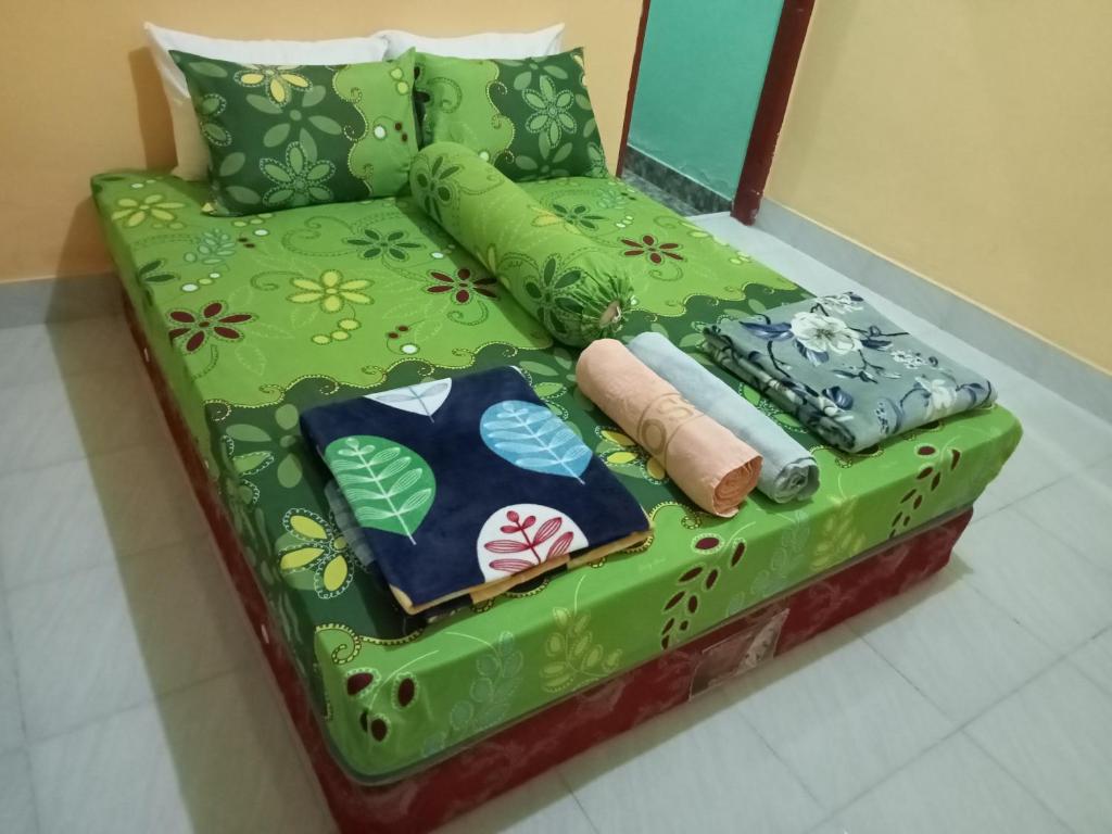 Postel nebo postele na pokoji v ubytování Zinzi's All-Inclusive Homestay