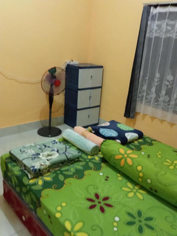 Postel nebo postele na pokoji v ubytování Zinzi's All-Inclusive Homestay