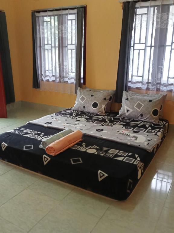 Postel nebo postele na pokoji v ubytování Zinzi's All-Inclusive Homestay