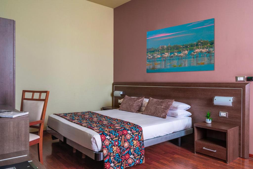 Postel nebo postele na pokoji v ubytování Hotel Formula Int. & Puravita SPA