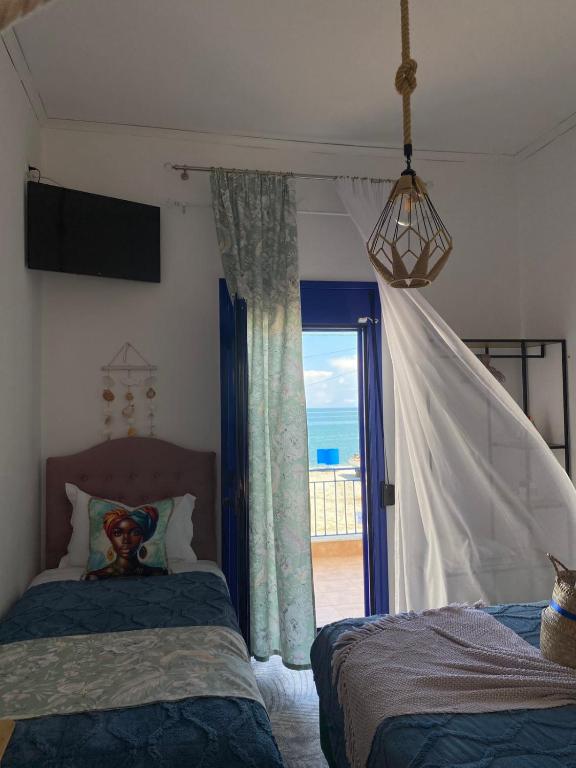 Postel nebo postele na pokoji v ubytování Mana mia Seaside Apartments