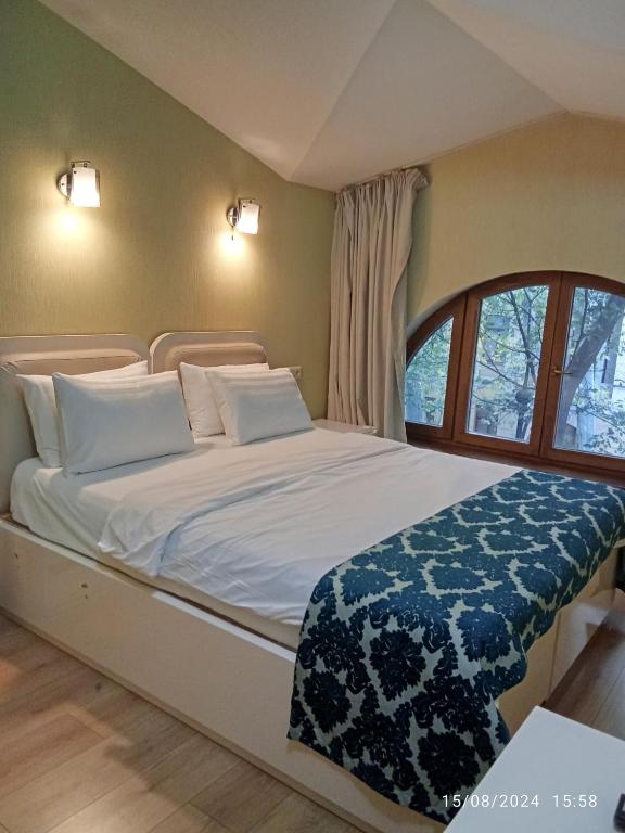 Postel nebo postele na pokoji v ubytování Grand Hotel Bennet