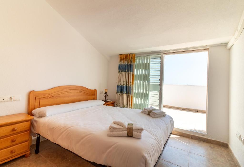 Posteľ alebo postele v izbe v ubytovaní Global Properties, Adosado en primera linea de playa con vistas al mar
