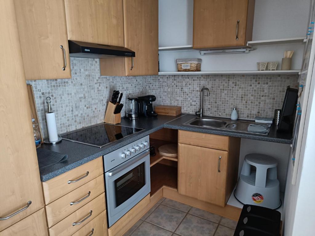 Kuchyň nebo kuchyňský kout v ubytování Apartment Casa Gina
