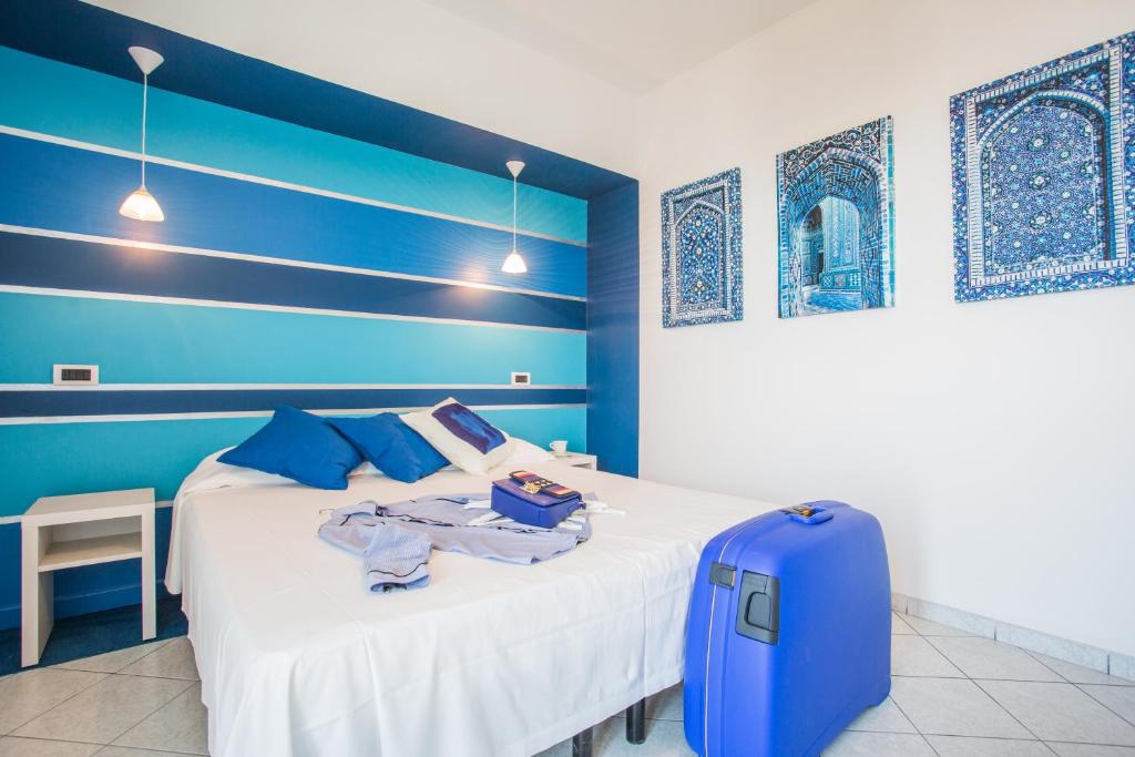 Postel nebo postele na pokoji v ubytování Hotel Thea