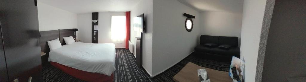 Postel nebo postele na pokoji v ubytování Brit Hotel Reims La Neuvillette