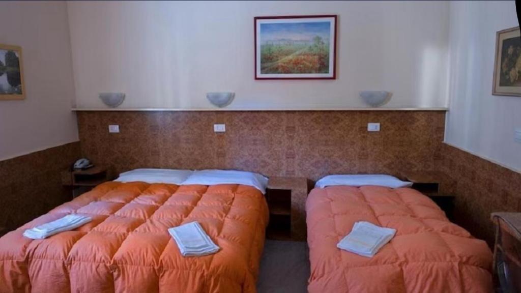 Postel nebo postele na pokoji v ubytování hotel fiumara