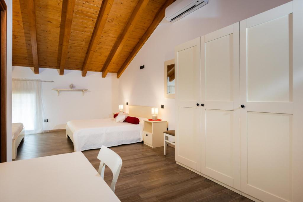 Postel nebo postele na pokoji v ubytování Hotel AL COLLIO