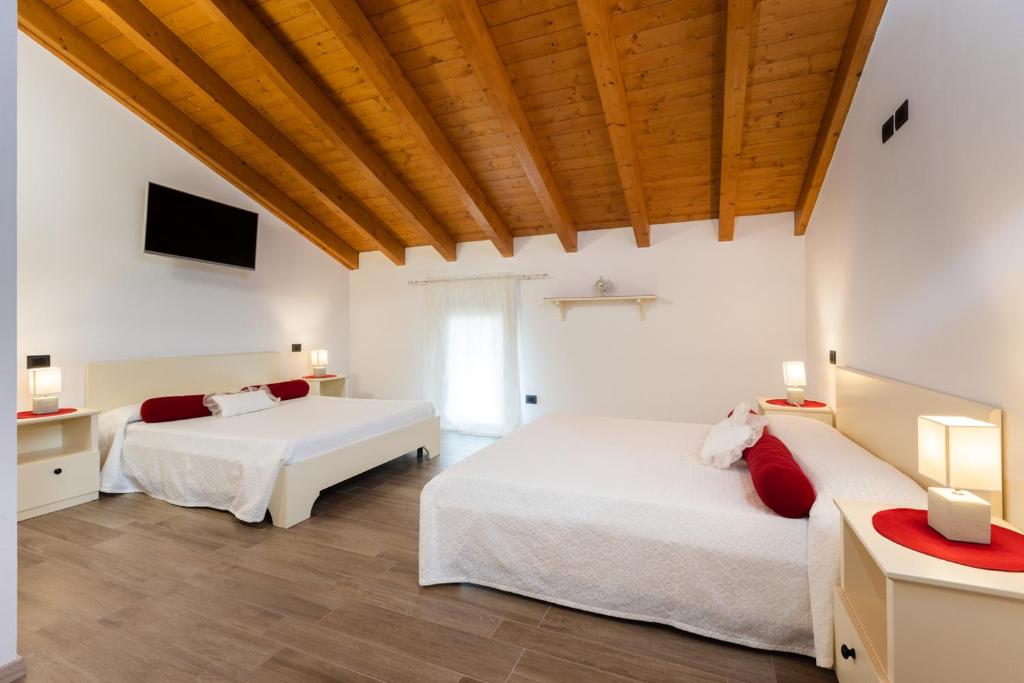 Postel nebo postele na pokoji v ubytování Hotel AL COLLIO