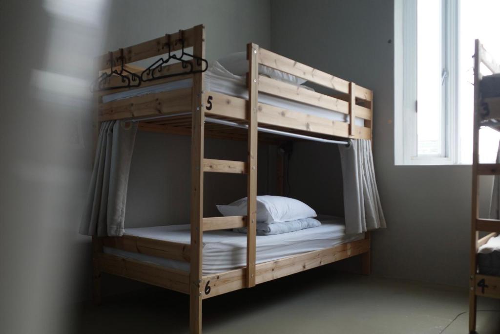 Postel nebo postele na pokoji v ubytování Ji Zi Inn