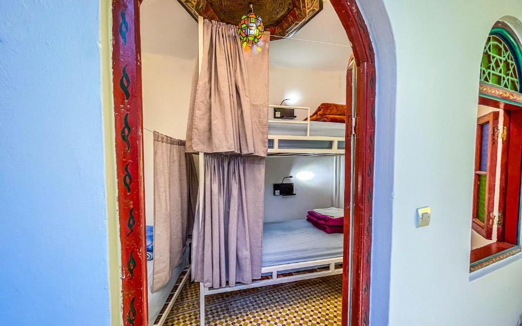 Una cama o camas en una habitación de Tangiers Hostel