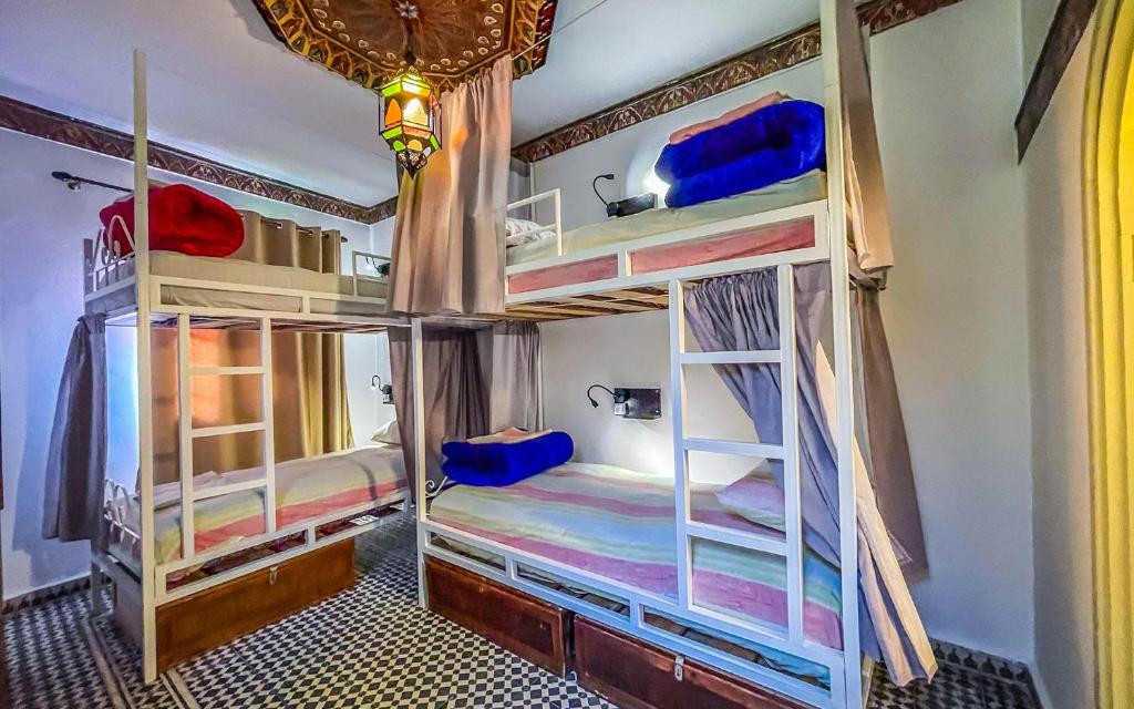 Una cama o camas en una habitación de Tangiers Hostel