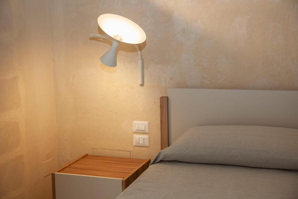 Postel nebo postele na pokoji v ubytování Dimora Gattini
