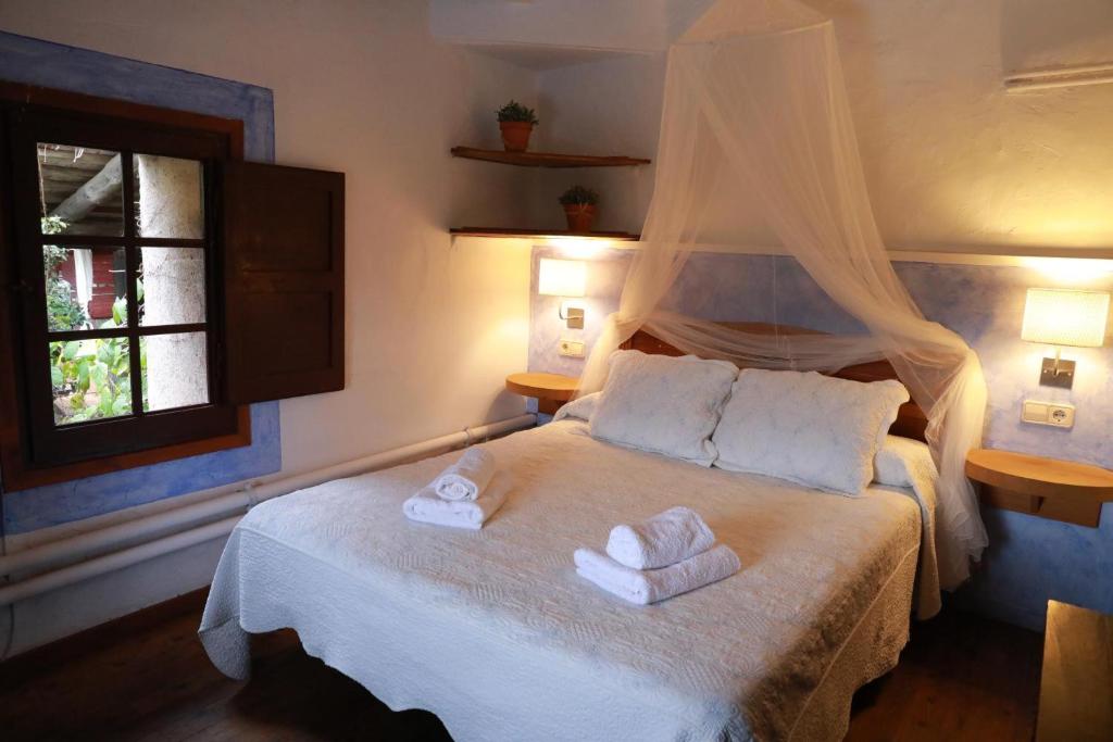 Posteľ alebo postele v izbe v ubytovaní Casa del Pastor-Brugarolas Village