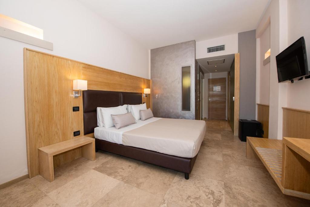 Postel nebo postele na pokoji v ubytování Basiliani - CDSHotels