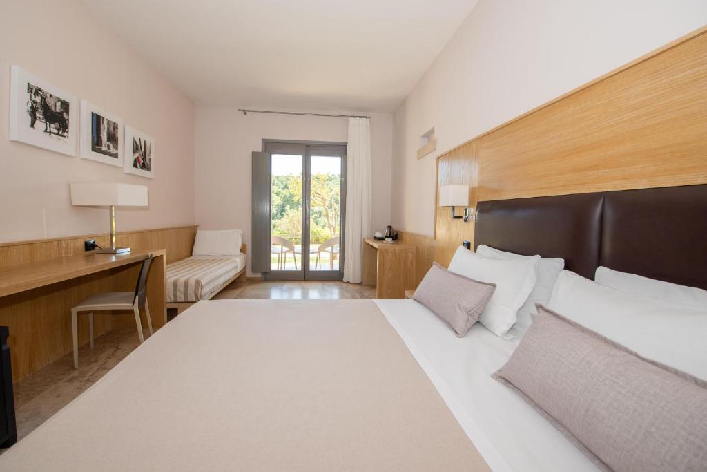 Postel nebo postele na pokoji v ubytování Basiliani - CDSHotels