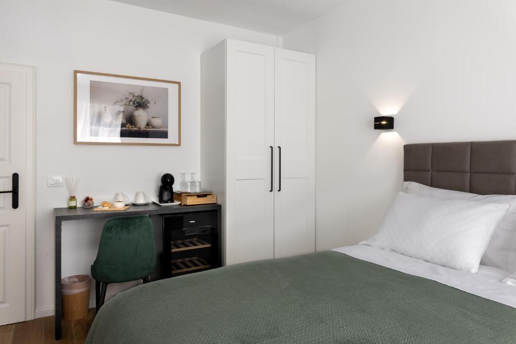 Postel nebo postele na pokoji v ubytování Olea Delux Rooms