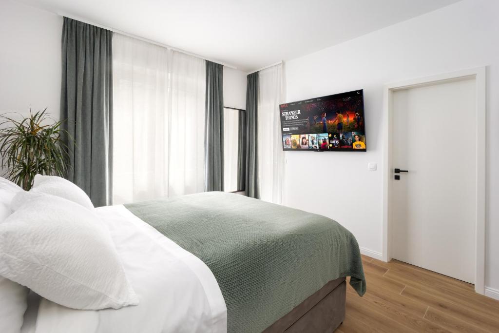 Postel nebo postele na pokoji v ubytování Olea Delux Rooms