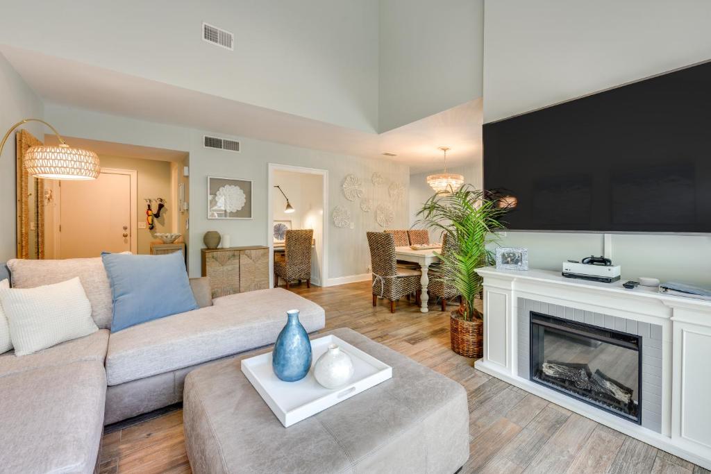 a living room with a couch and a fireplace at Tennis, Golf and More Seabrook Island Getaway! in Seabrook Island