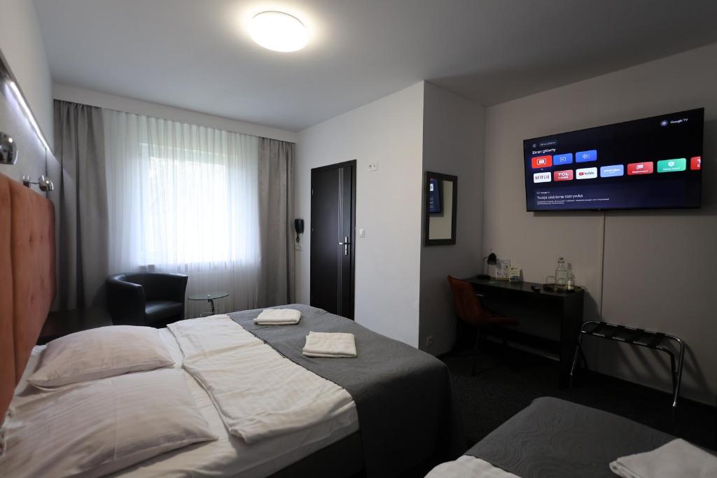 Posteľ alebo postele v izbe v ubytovaní Hotel Junior