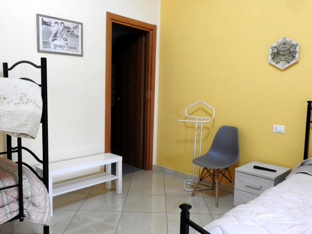 Postel nebo postele na pokoji v ubytování Il cappello sulle 23! Camere in affitto breve