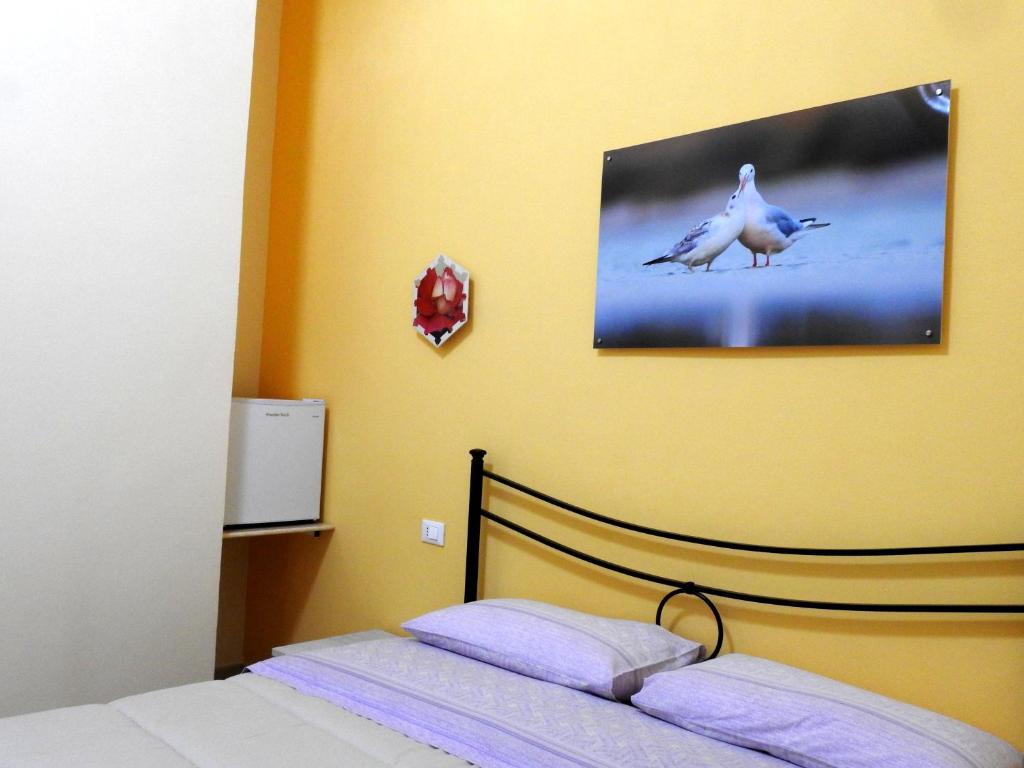Postel nebo postele na pokoji v ubytování Il cappello sulle 23! Camere in affitto breve