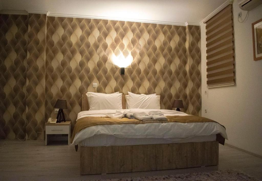 Postel nebo postele na pokoji v ubytování Hotel Alisa