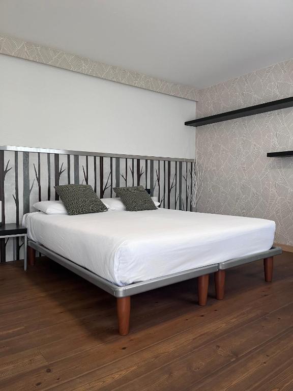 Łóżko lub łóżka w pokoju w obiekcie Hotel Isola Verde