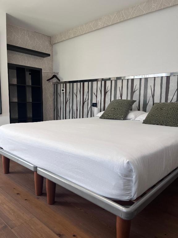 Łóżko lub łóżka w pokoju w obiekcie Hotel Isola Verde