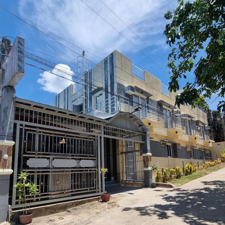 a building with a gate in front of it at Abrhys Ridge Inn in Coron