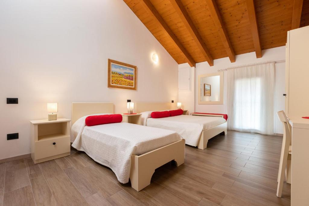 Postel nebo postele na pokoji v ubytování Hotel AL COLLIO