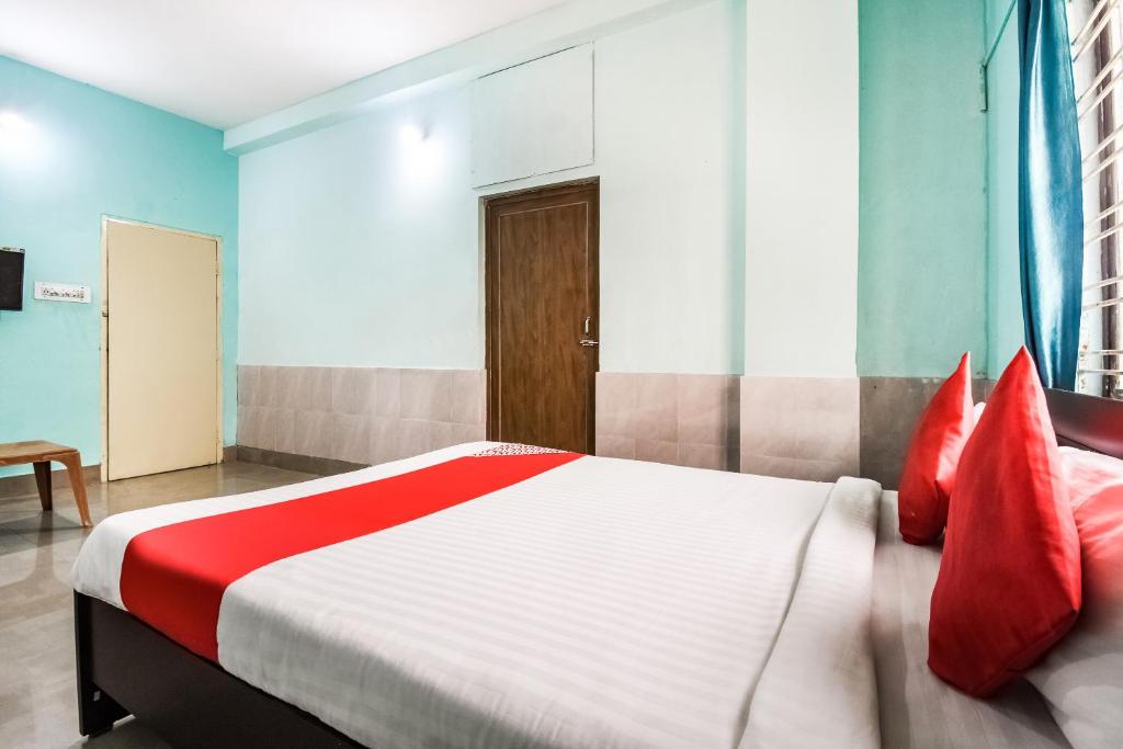 Postel nebo postele na pokoji v ubytování Hotel O Tm Delights