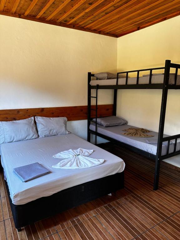 Postel nebo postele na pokoji v ubytování Chalés