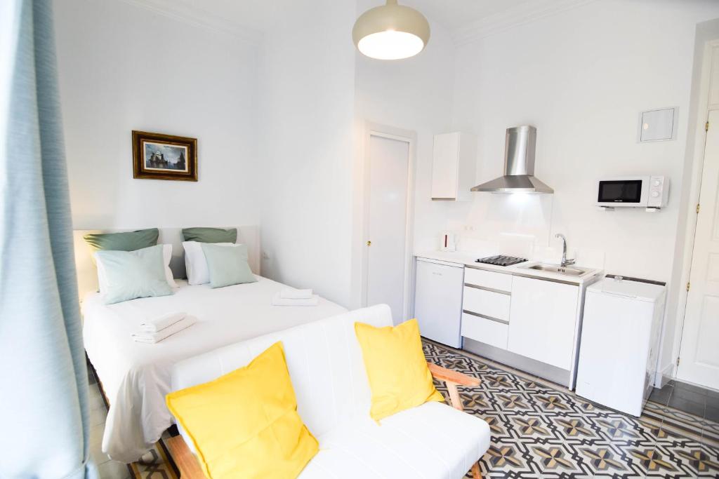Posteľ alebo postele v izbe v ubytovaní Letmalaga Soho Apartments