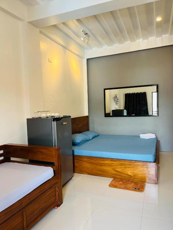Uma cama ou camas num quarto em FN Lodge - town proper