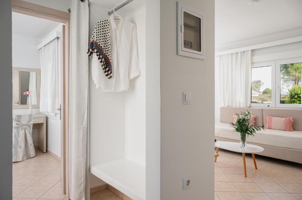 A bed or beds in a room at Naftilos Rosmarinus Apartments