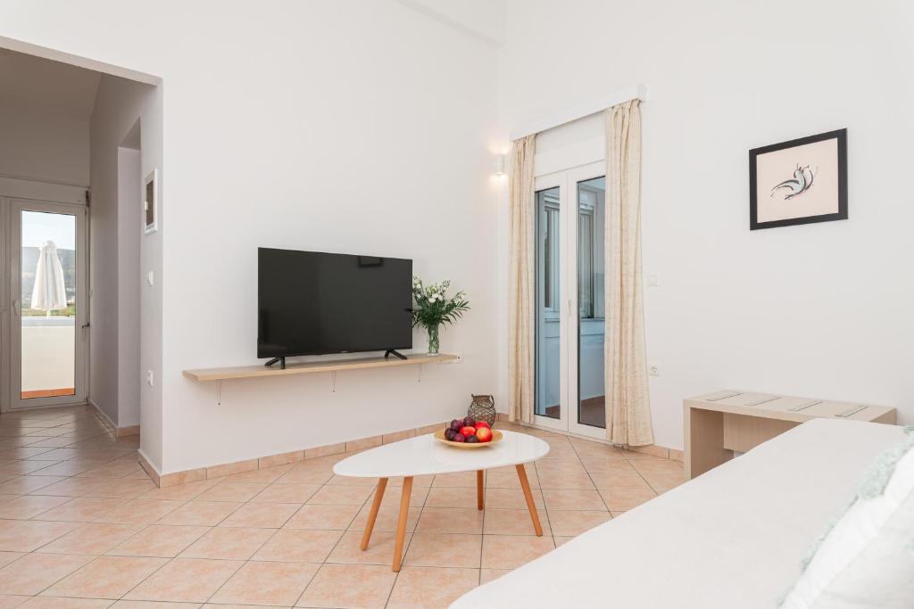 A television and/or entertainment centre at Naftilos Rosmarinus Apartments