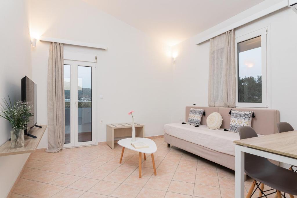 A television and/or entertainment centre at Naftilos Rosmarinus Apartments