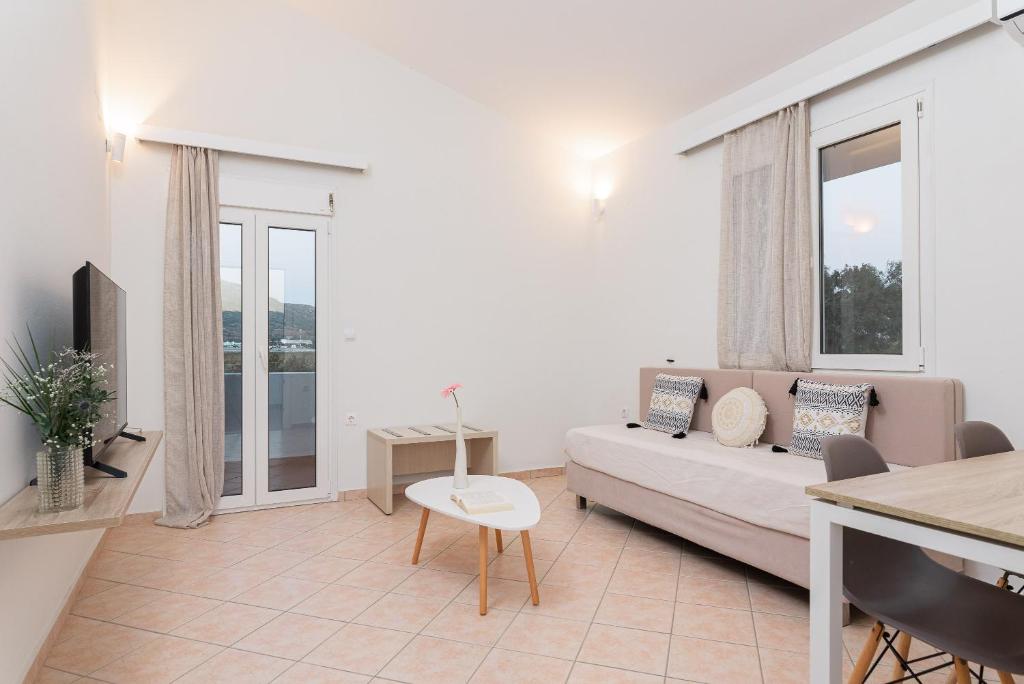 A bed or beds in a room at Naftilos Rosmarinus Apartments