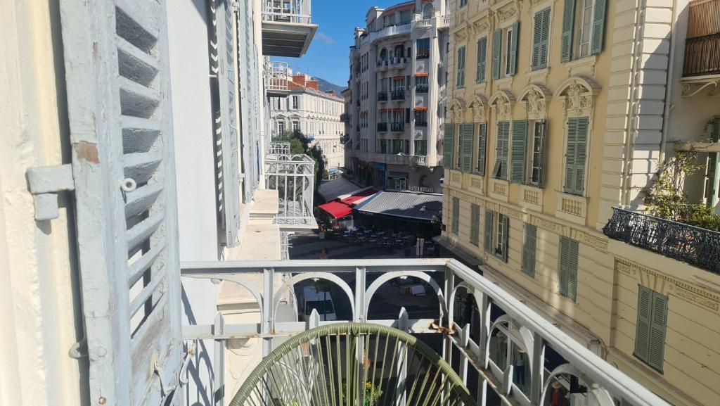 a view from the balcony of a building at Le Petit Trianon et le Charme des Suites in Nice