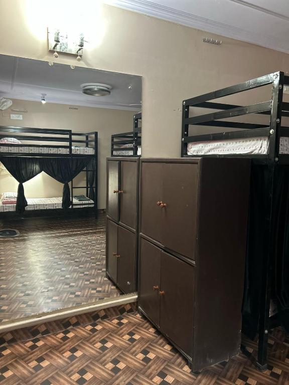 Postel nebo postele na pokoji v ubytování SREA Homestead Dormitory